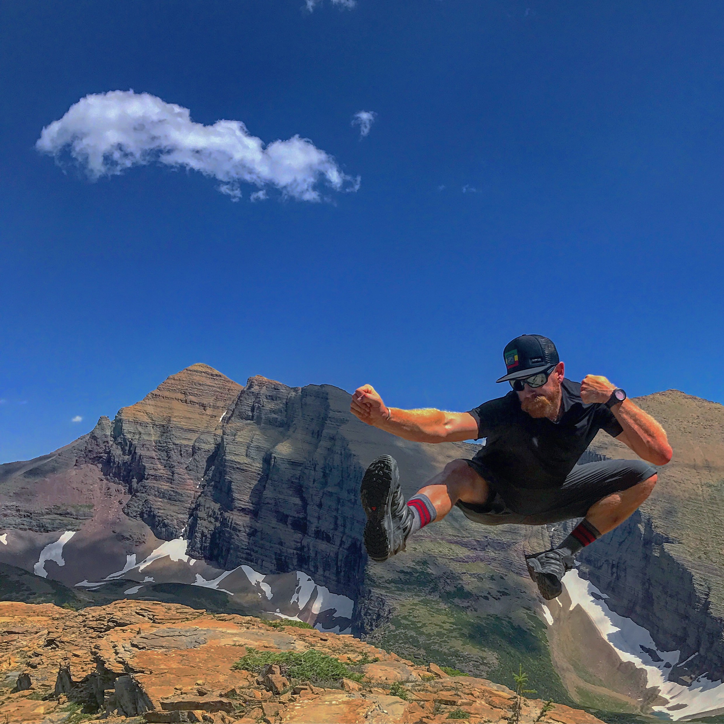 Donovan jumping for joy in Glacier National Park
